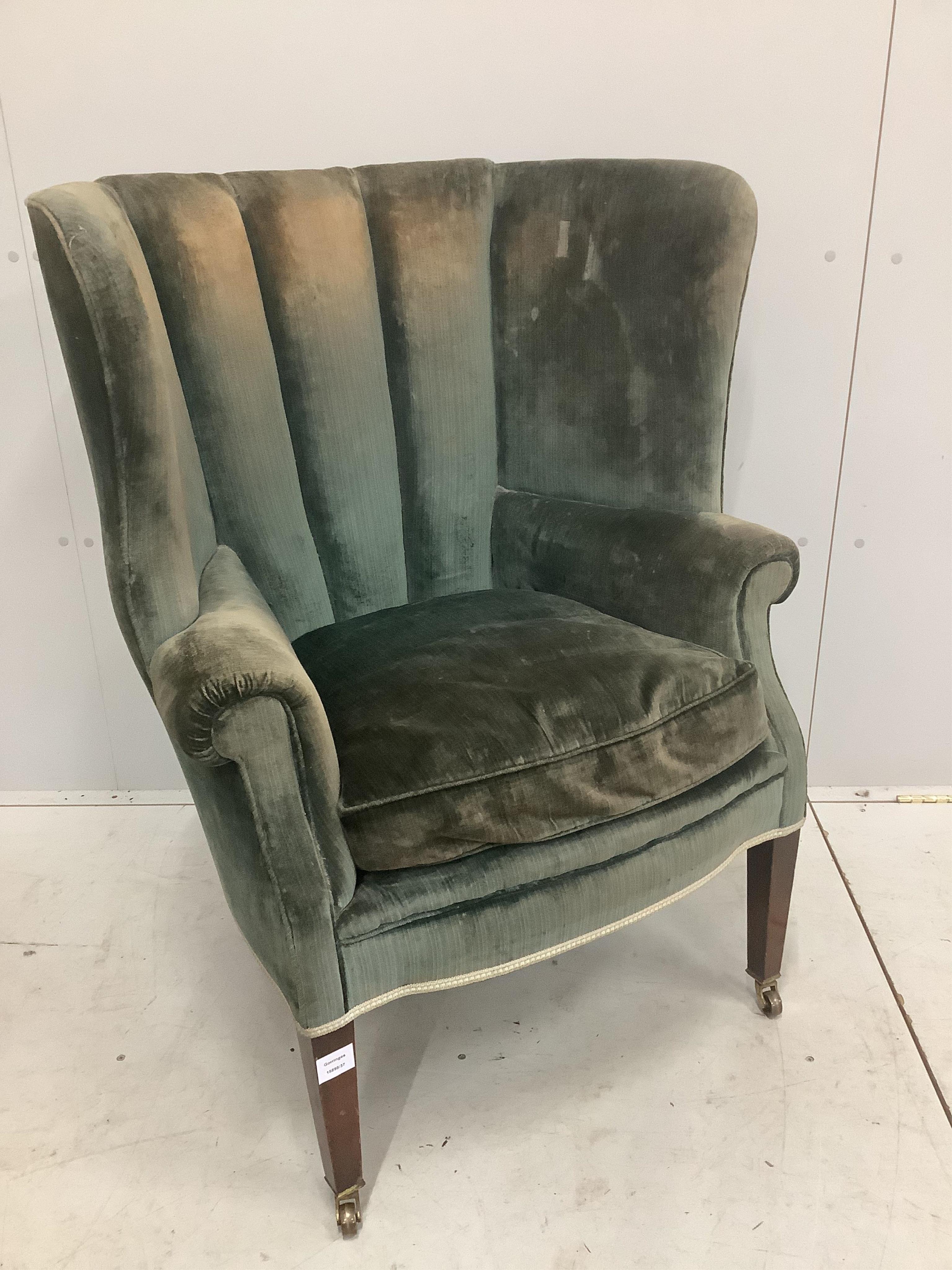 A Regency style mahogany tub framed wing armchair, width 78cm, depth 70cm, height 103cm. Condition - poor to fair